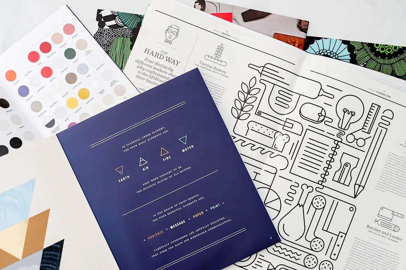 Brand collateral and identity sheets laid out on a table