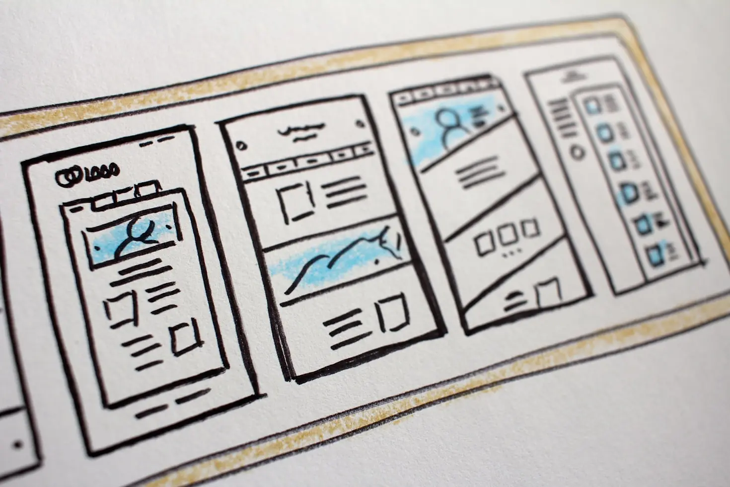 Website wireframes sketched on paper